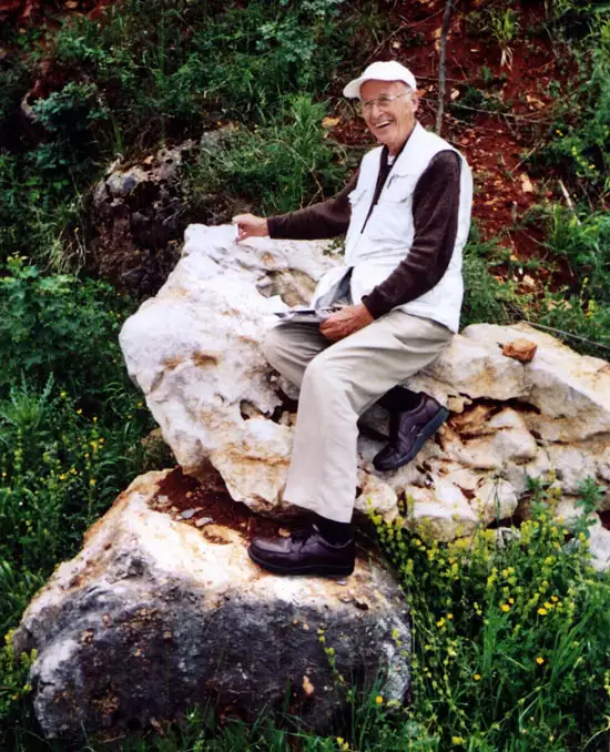 Founder of PELA, Dr. Philip E. LaMoreaux, sitting atop a limestone structure